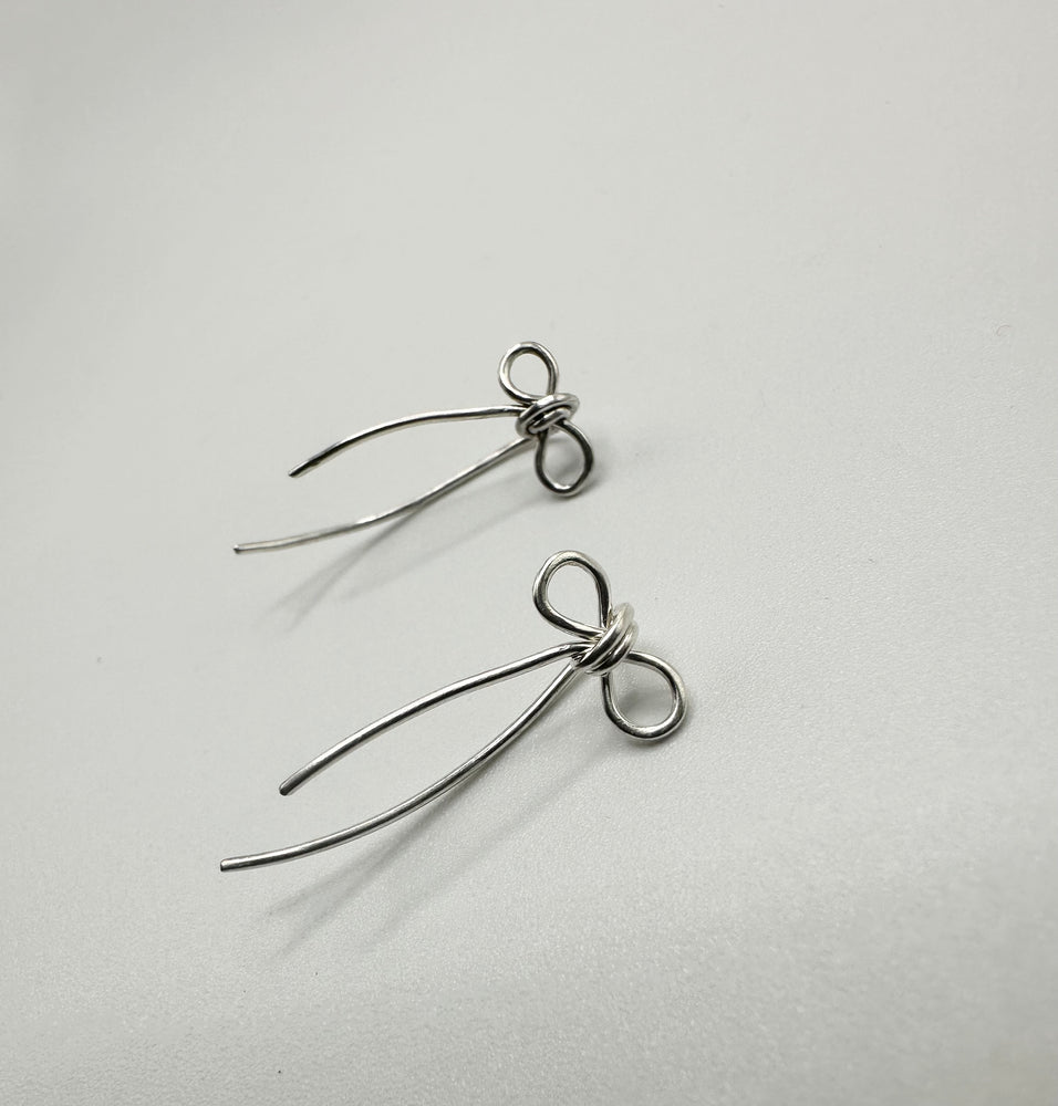 
                  
                    Sterling silver, bow threaders
                  
                