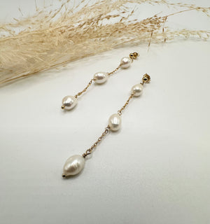 
                  
                    Elongated pearl drop gold filled earring
                  
                