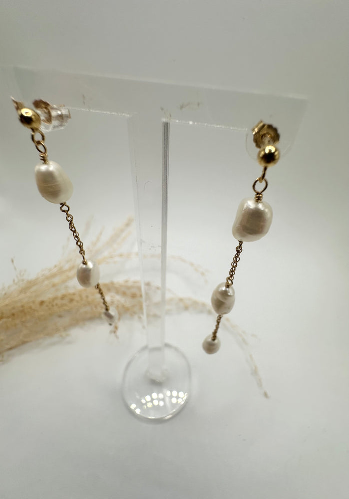 
                  
                    Elongated pearl drop gold filled earring
                  
                