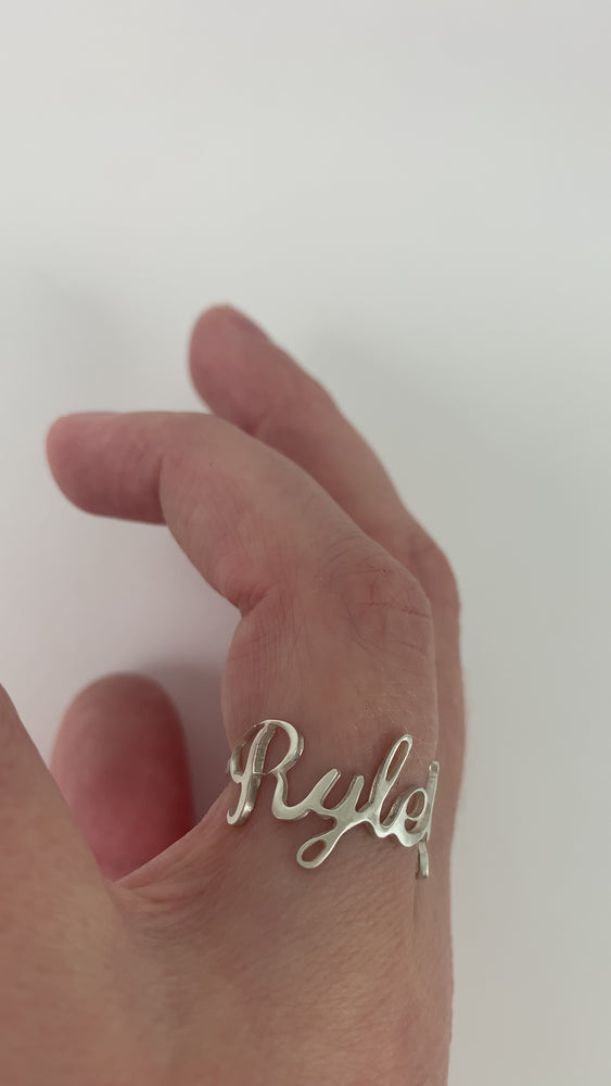 
                  
                    Load and play video in Gallery viewer, Custom Sterling Silver Cursive Name Ring
                  
                